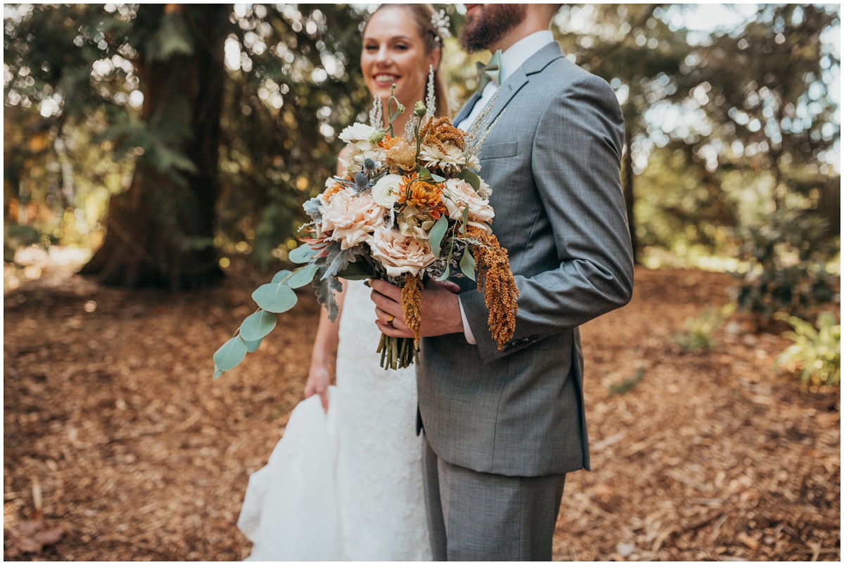 groom holds brides bouquet | glenwood treefarm tacoma washington photographer