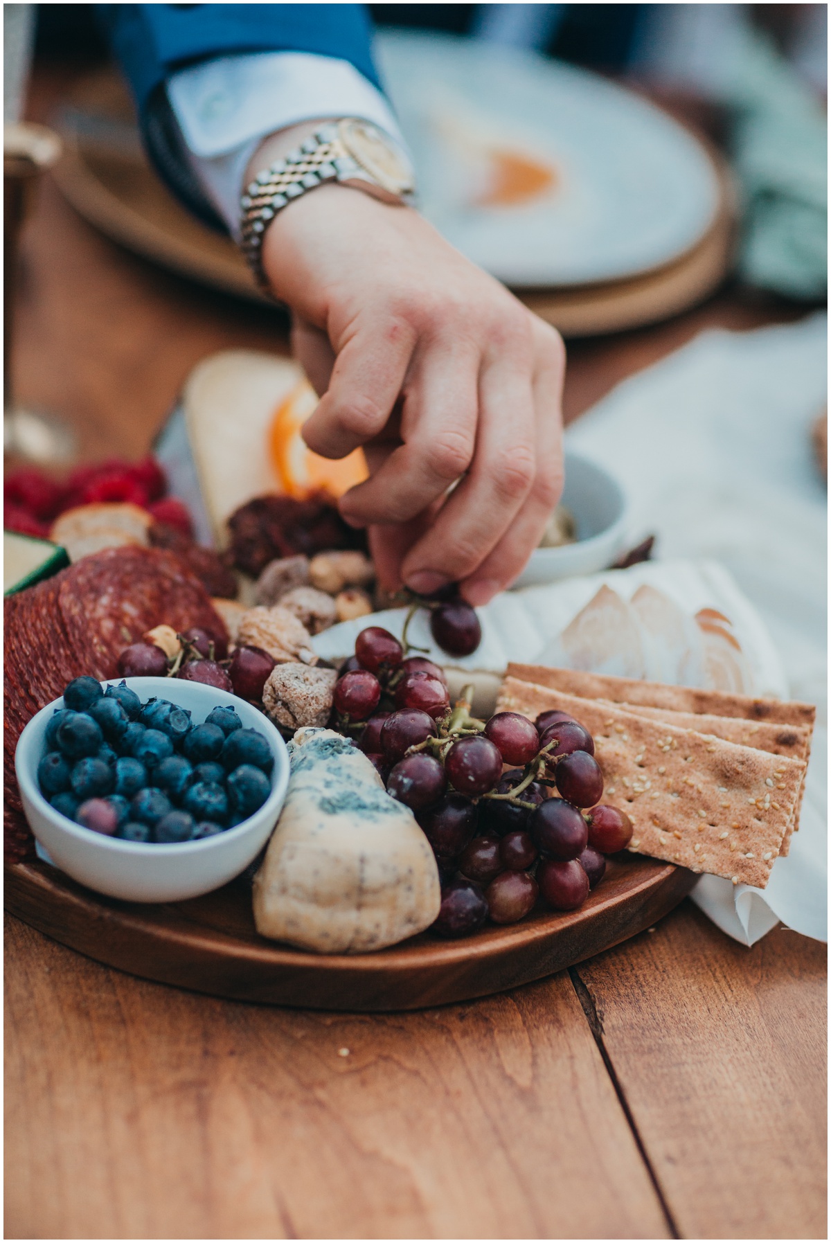 groom eating hor d'oeuvre | Gold Creek Pond Washington Elopement Photographer