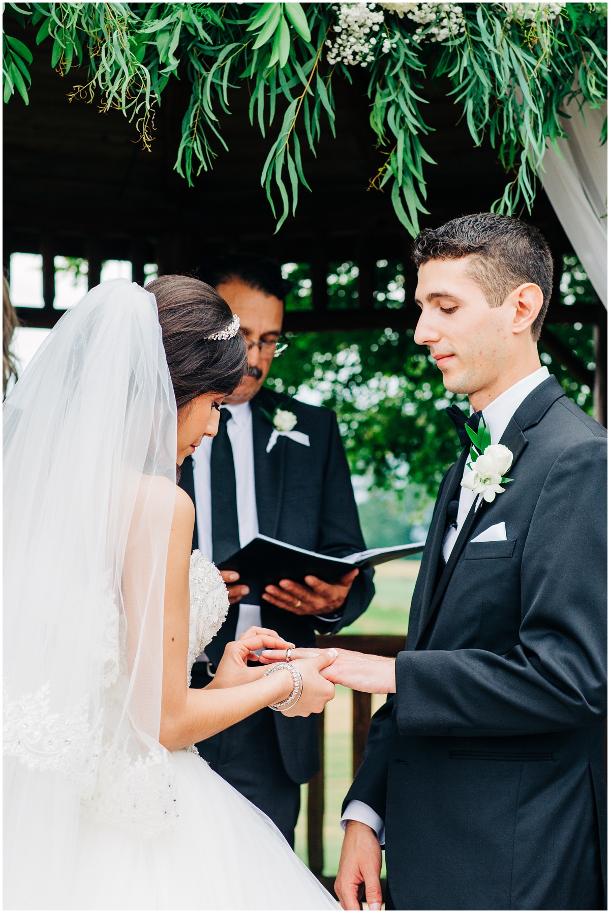 bride putting ring on groom| Hidden Meadows Wedding Snohomish Washington