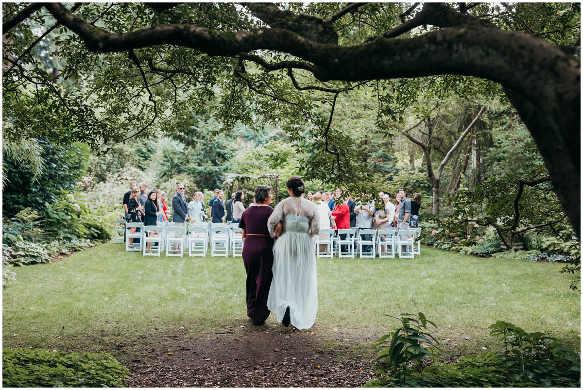 mother walking bride down aisle