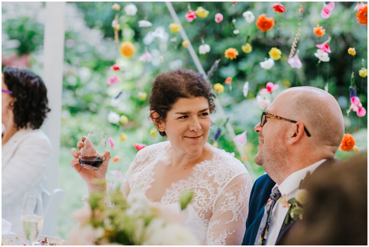 bride looking at groom during reception