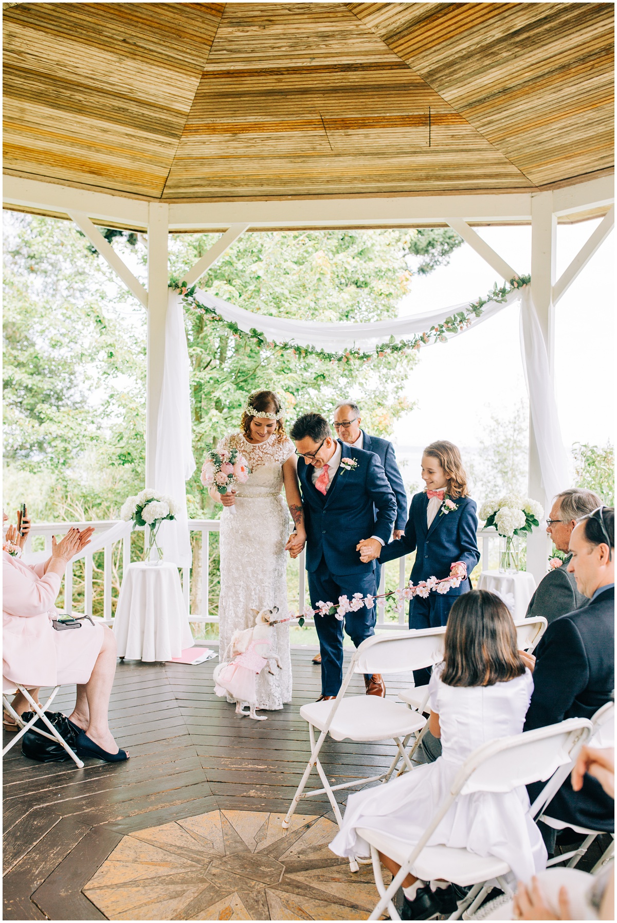 bride and groom with dog and son after ceremony