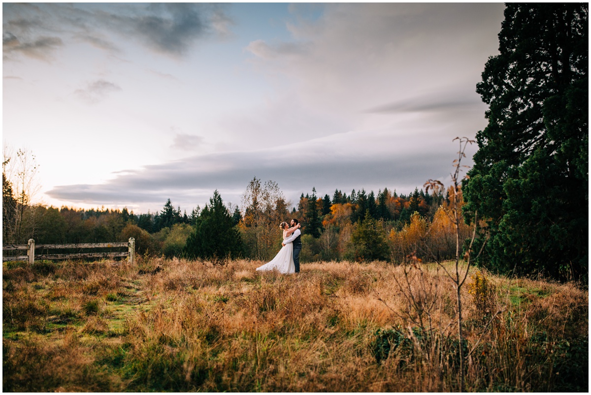 romantic portrait of bride and groom at sunset