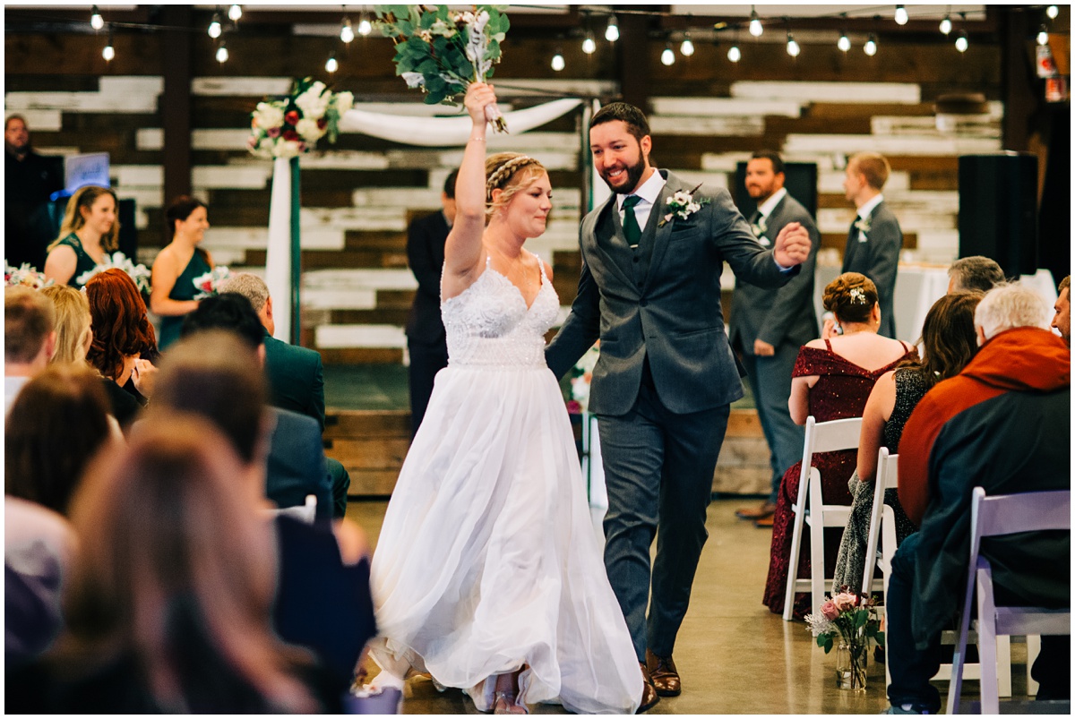 bride and groom walk down aisle after ceremony