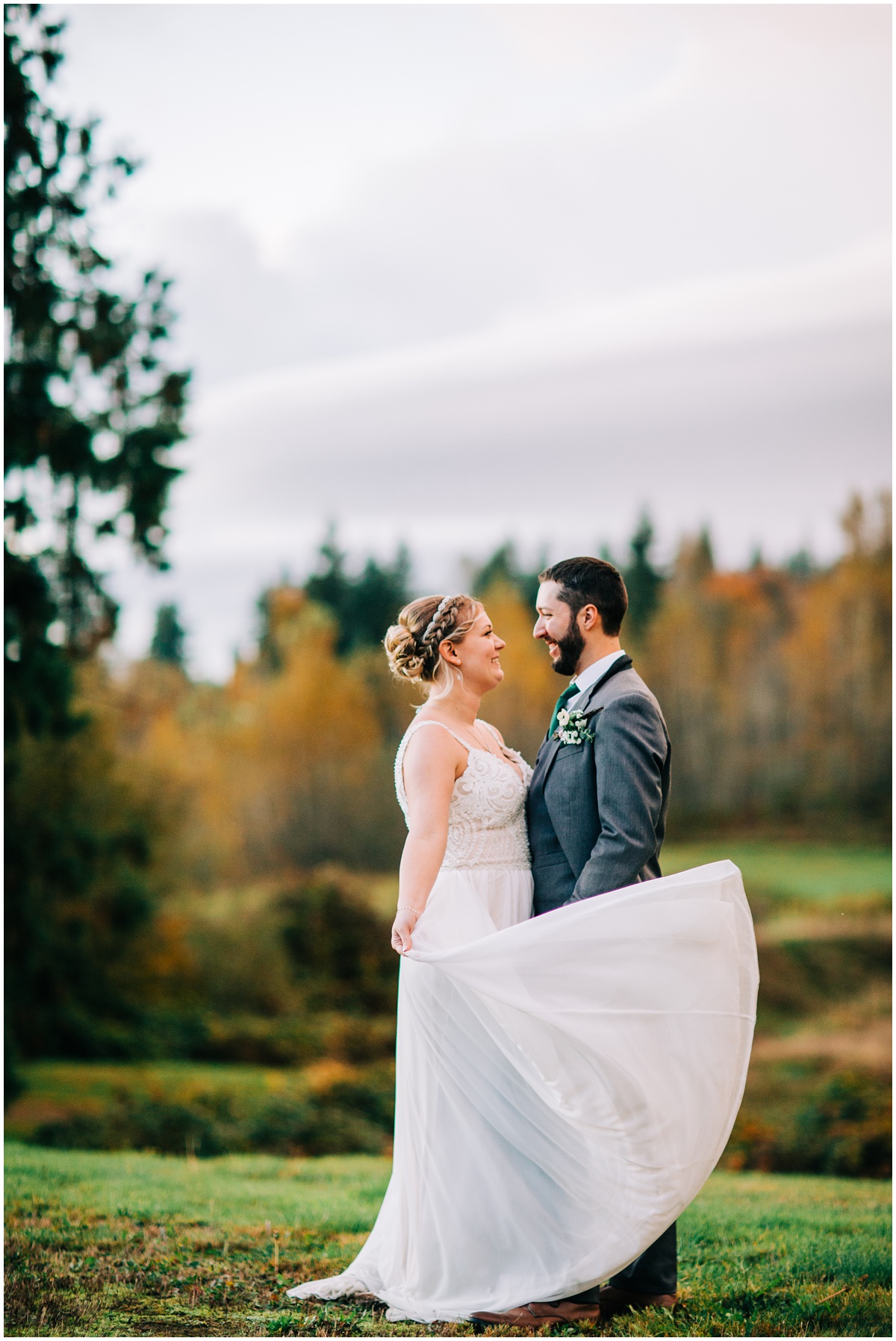 groom with bride swishing her dress