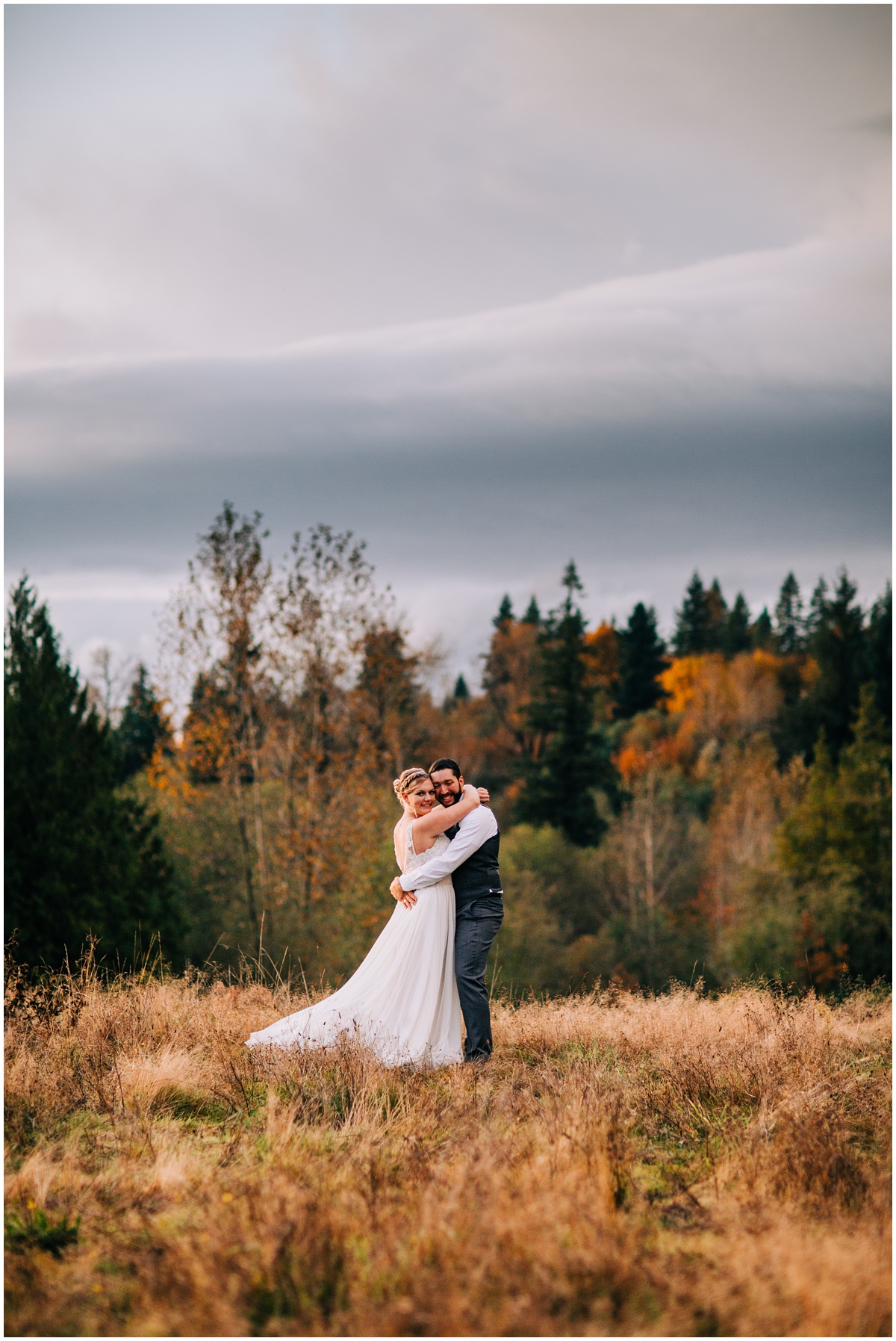 bride and groom hugging in sunset