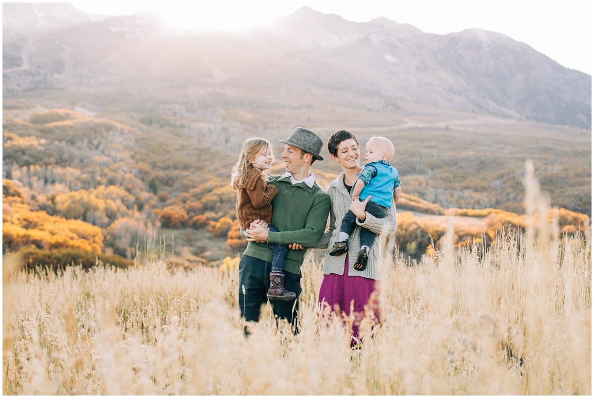 family looking at each other at sunset