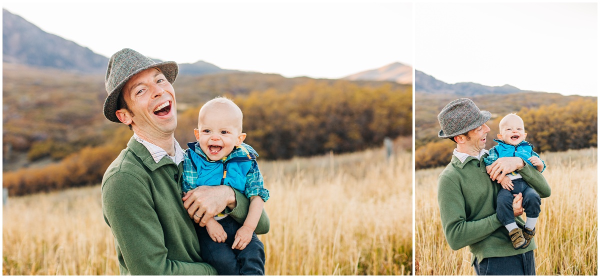 father holding son and smiling