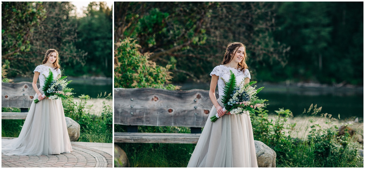 bride poses on stones in long dress