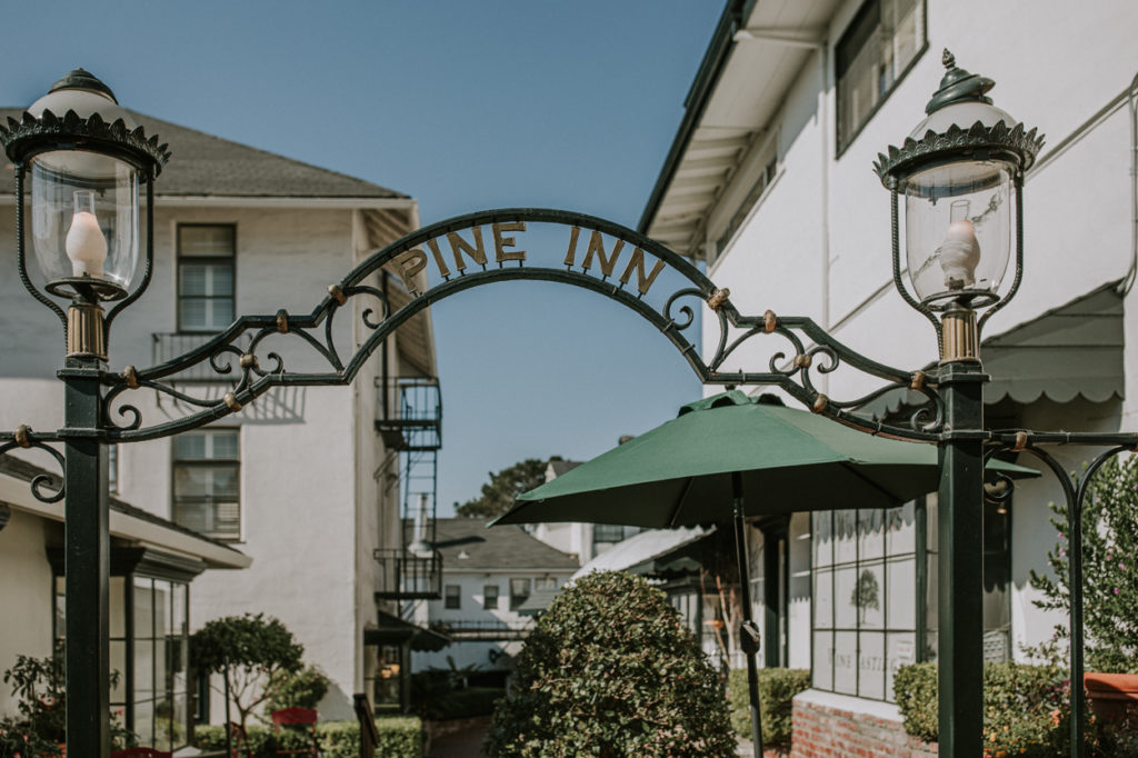 hotel entrance with gate and sign