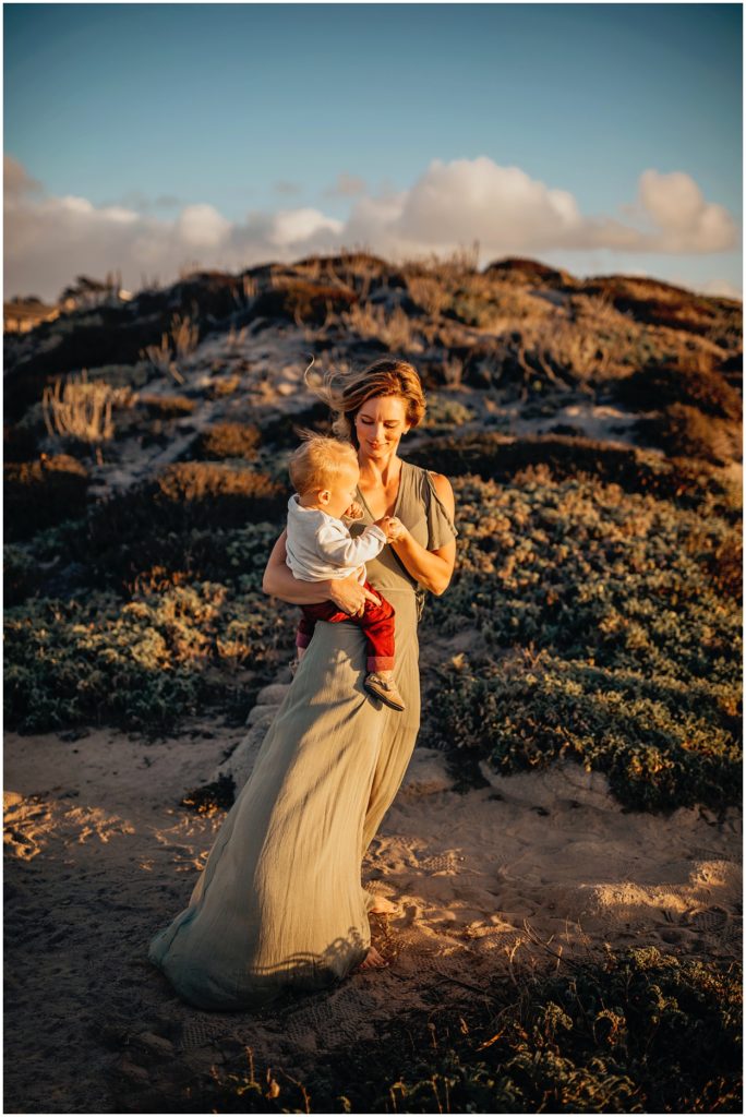 mom holding son at asilomar beach