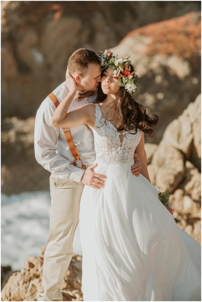 bride standing by groom at big sur cliff