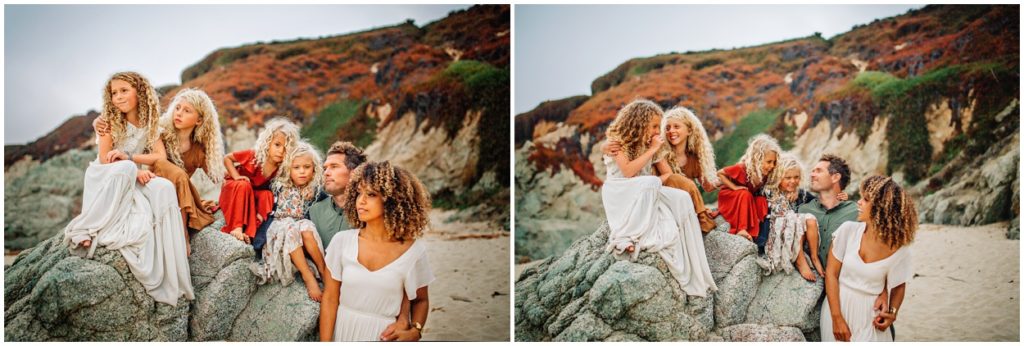 family playing on rock at garapata beach