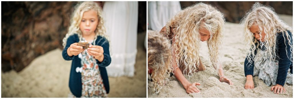 curly hair girls playing in sand on beach