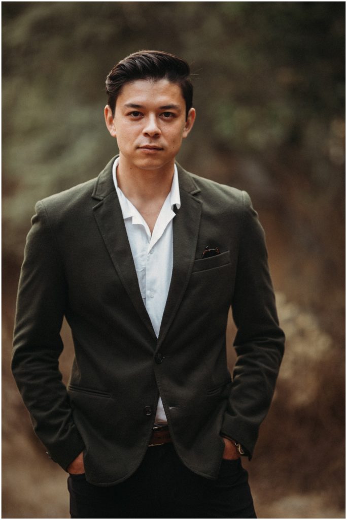 groom standing with hands in pockets