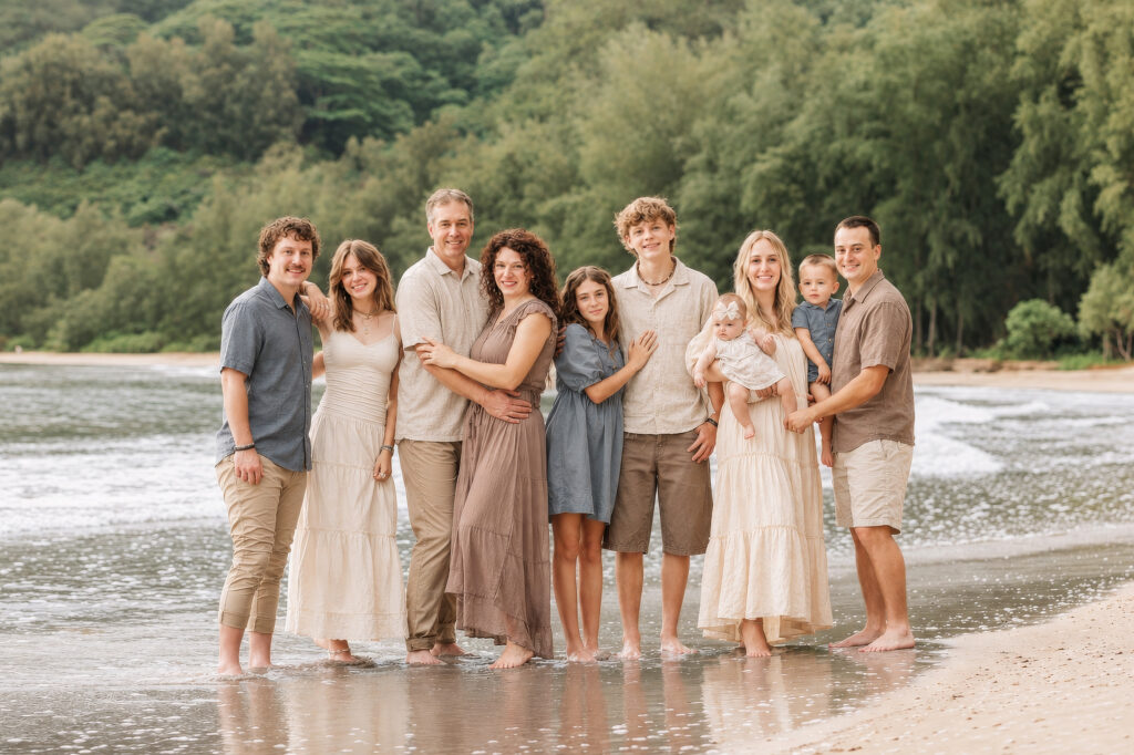 family wearing cream, blue, taupe, tan