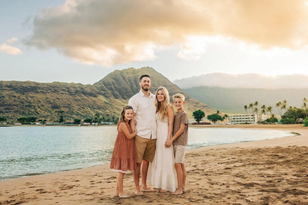 family wearing cream, taupe, camel, rust at beach